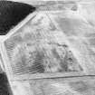 Dumbarnie, oblique aerial view, taken from the W, centred on a cropmark complex and showing cultivation remains in the centre left of the photograph.
