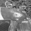 Kirkton of Largo, oblique aerial view, taken from the NNW, centred on the cropmarks of a ring-ditch, enclosure and pits.