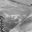 Dairsie Mill, oblique aerial view, taken from the SE, centred on cropmarks, with cropmarks of a ring-ditch and a possible unenclosed settlement to the top of the photograph.