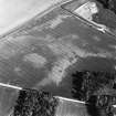 Kirkton Barns, oblique aerial view, taken from the NW, centred on cropmarks of an unenclosed settlement.