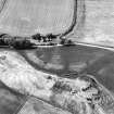 Kirktonbarns, oblique aerial view, taken from the S, centred on linear cropmarks and cropmarks of cultivation remains and a possible timber building.