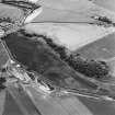 Oblique aerial photograph of Milton, Leuchars and Pusk Wood centred on cropmarks, taken from the NE. Cropmarks of cultivation remains, a possible souterrain and  a sunken floored house are situated to the W. A cropmark complex is situated to the NE, in the bottom left corner of the photograph.