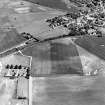 Oblique aerial view of cropmark complex and Leuchars cemetery, taken from the W.