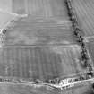 Oblique aerial view centred on the cropmarks of pits, a roundhouse, possible enclosure and rig, taken from the N.
