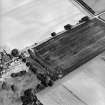 Oblique aerial view centred on the cropmarks of the ring-ditch, taken from the S.