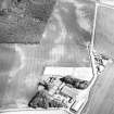 Mains of Kelly and Cotton of Balcathie, oblique aerial view, taken from the NW, centred on the cropmarks of a possible unenclosed settlement and enclosures. Further cropmarks of an unenclosed settlement, a souterrain and rig are visible in the top half of the photograph.