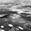 Oblique aerial view of White Caterthun centred on the remains of a fort, taken from the W.
