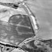 Boysack, oblique aerial view, taken from the NNE, centred on the cropmarks of barrows and ring-ditches. A possible round house and a pit-alignment are visible in the bottom right-hand corner of the photograph.