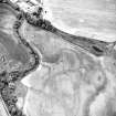 Oblique aerial view centred on the cropmarks of the barrows, ring-ditches and linear cropmarks, taken from the NNW.