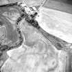 Oblique aerial view centred on the cropmarks of the barrows, ring-ditches and linear cropmarks, taken from the NW.