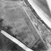 Oblique aerial view centred on the cropmarks of the unenclosed settlement, enclosures, possible souterrains and linear cropmarks, taken from the SSW.