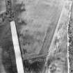 Oblique aerial view centred on the cropmarks of the unenclosed settlement, enclosures, possible souterrains and linear cropmarks, taken from the SE.