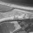 Oblique aerial view centred on the cropmarks of the unenclosed settlement and linear cropmarks, taken from the SW.