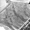 Oblique aerial view centred on the cropmarks of the possible enclosure, ring-ditch and pits, taken from the WNW.