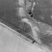 Oblique aerial view centred on the cropmarks of the ring-ditch, taken from the NE.