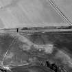 Oblique aerial view centred on the cropmarks of the ring-ditch, taken from the W.