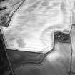 Newbarns, oblique aerial view, taken from the ENE, centred on cropmarks including those of two palisaded enclosures and pits. Further cropmarks are visible in the top half of the photograph.