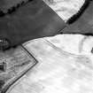 Newbarns Smithy, oblique aerial view, taken from the NNE, centred on cropmarks including those of an unenclosed settlement and a field boundary. Further cropmarks are visible in the centre left of the photograph.