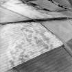 Oblique aerial view centred on the cropmarks of the unenclosed settlements, pit-alignment, pits and rig, taken from the ESE.