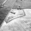 Newbarns Smithy, oblique aerial view, taken from the N, centred on cropmarks including those of pits.