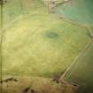 Oblique aerial view centred on the standing stone, taken from the E.