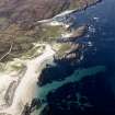 Oblique aerial view centred on the remains of the fish traps with the lazy-beds adjacent, taken from the NE.