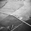 Oblique aerial view centred on the barrow, taken from the N.