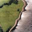 Oblique aerial view centred on the site of the chapel, taken from the NNE.