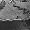 Oblique aerial view centred on the site of the chapel, taken from the NW.