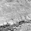 Oblique aerial view of Edentaggart centred on the remains of a farmstead, corn-drying kiln and head-dyke, taken from the N.