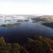General oblique aerial view looking across the S islands of Loch Lomond towards Alexandria, taken from the NNW.