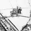 Oblique aerial view centred on the farmsteading with rig adjacent, taken from the SSW.