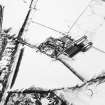 Oblique aerial view centred on the farmsteading with rig adjacent, taken from the SSE.
