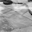 Oblique aerial photograph, taken from the E, centred on the cropmarks of a Roman Temporary Camp.