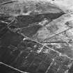 Avonhead Colliery, oblique aerial view, taken from the SSE, showing the spoil heaps of three coal mines in the centre of the photograph, an area of rig in the centre right, and peat cuttings in the bottom half.