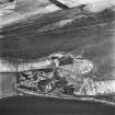 Hillhead, oblique aerial  view, taken from the NNE, showing the coal mine in the centre of the photograph with three bings visible, two by the lochside.