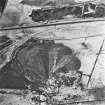 Calderhead Colliery and Easter Baton, oblique aerial view, taken from the SSE, showing the three bings of Calderhead Colliery coal mine in the bottom half of the photograph, and Easter Baton open-cast mine at the top edge.