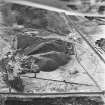 Calderhead Colliery, oblique aerial view, taken from the E, showing the three bings of Calderhead Colliery coal mine in the middle of the photograph.