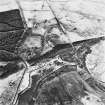 Dura Kirk, Kirkhall and Rumbling Sikes, oblique aerial view, taken from the N, showing the remains of Dura Kirk in the centre left of the photograph, Kirkhall farmstead in the top half, and and an area of rig at Rumbling Sikes in the top left-hand corner.