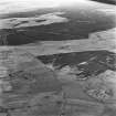 Belstane Burn, Bogside and Gair, oblique aerial view, taken from the SW, showing Belstane Burn Quarry and rig in the bottom right-hand corner of the photograph, and the farmsteads of Bogside and Gair in the centre. An area of Rig near Gair can be seen in the left centre.