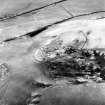 Black Hill, Lesmahagow, oblique aerial view, taken from the E, centred on the fort, settlement and cairn.