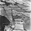 Strathavon and Nappyfaulds, oblique aerial view, taken from the W, showing Nappyfaulds farmstead and an area of rig in the centre of the photograph and Strathavon coal mines and a mineral railway in the top right-hand corner.