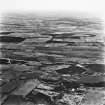 Darnrigg, Strathavon and Barleyside, oblique aerial view, taken from the SSE, showing Darnrigg open-cast mine and wasteground, and Strathvon coal mine at the bottom of the photograph, and an area of rig at Barleyside across the centre.