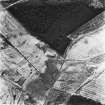 Salterhill, Drumclair and Airdriemain, oblique aerial view, taken from the NE, showing Salterhill coal mine and an adjoining railway in the bottom right-hand corner of the photograph, the remains of miners' rows and a railway at Drumclair in the bottom left, and an area of rig at Airdriemain in the bottom right-hand corner..