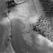 Oblique aerial view centred on the cropmarks of the fort, taken from the SE.