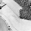 Oblique aerial view centred on the cropmarks of the fort, taken from the S.