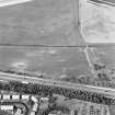 Oblique aerial view centred on the cropmarks of a possible pit-alignment, taken from the SSW.