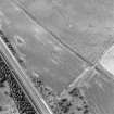 Oblique aerial view centred on the cropmarks of a possible pit-alignment, taken from the SSE.