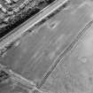 Oblique aerial view centred on the cropmarks of a possible pit-alignment, taken from the ENE.