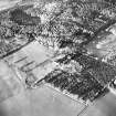 Oblique aerial view centred on the remains of the castle, taken from the SE.